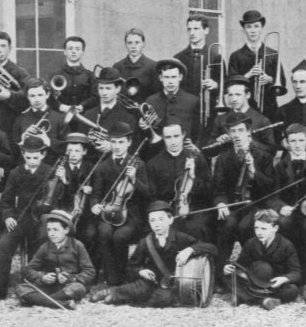 image of Patrick Fagan in school orchestra holding trumpet
